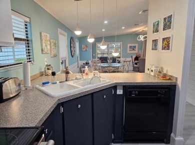 TIRED OF SNOW,ICE AND COLD, TRADE IT IN FOR SUN,WARM AND WHITE on Lake Fairways Country Club in Florida - for sale on GolfHomes.com, golf home, golf lot