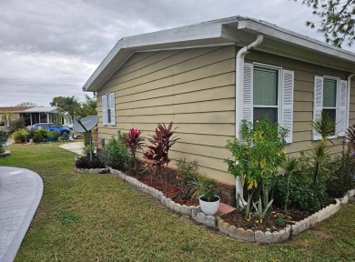 TIRED OF SNOW,ICE AND COLD, TRADE IT IN FOR SUN,WARM AND WHITE on Lake Fairways Country Club in Florida - for sale on GolfHomes.com, golf home, golf lot