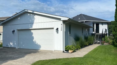 Beautifully updated home located on Serene LAKEFRONT lot in a for sale on GolfHomes.com