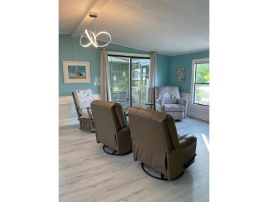 TIRED OF SNOW,ICE AND COLD, TRADE IT IN FOR SUN,WARM AND WHITE on Lake Fairways Country Club in Florida - for sale on GolfHomes.com, golf home, golf lot