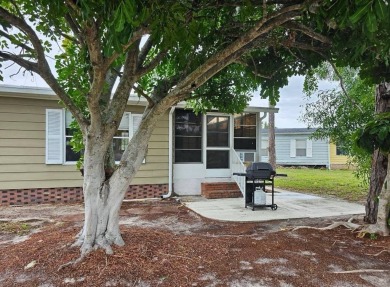 TIRED OF SNOW,ICE AND COLD, TRADE IT IN FOR SUN,WARM AND WHITE on Lake Fairways Country Club in Florida - for sale on GolfHomes.com, golf home, golf lot