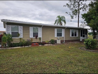 TIRED OF SNOW,ICE AND COLD, TRADE IT IN FOR SUN,WARM AND WHITE on Lake Fairways Country Club in Florida - for sale on GolfHomes.com, golf home, golf lot