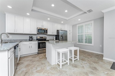 Sweeping golf course AND water views abound from this desirable on Heritage Landing Golf  in Florida - for sale on GolfHomes.com, golf home, golf lot