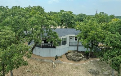 Scenic drive up gives way to a fully remodeled, turnkey home on Nocona Hills Golf Course in Texas - for sale on GolfHomes.com, golf home, golf lot