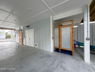 Charming Sunset Beach House custom built in 2023 is simply on Oyster Bay Golf Links in North Carolina - for sale on GolfHomes.com, golf home, golf lot