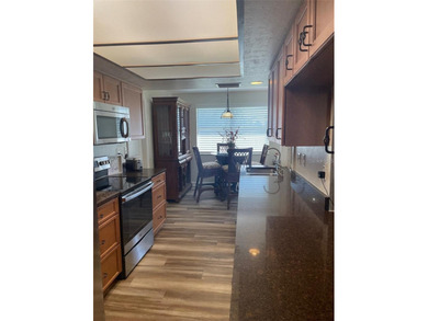 Welcome to this beautifully maintained 3-bedroom, 2-bath, 2-car on Deep Creek Golf Club in Florida - for sale on GolfHomes.com, golf home, golf lot