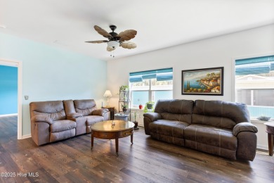 Welcome to this charming 2-bedroom, 2-bath home located just a on Oyster Bay Golf Links in North Carolina - for sale on GolfHomes.com, golf home, golf lot