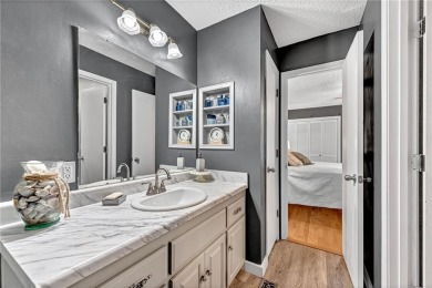 Discover this end-unit townhome with seasonal views of Lake on Bella Vista Country Club - Berksdale in Arkansas - for sale on GolfHomes.com, golf home, golf lot