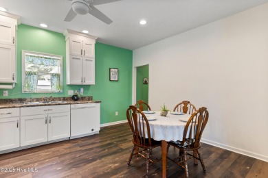 Welcome to this charming 2-bedroom, 2-bath home located just a on Oyster Bay Golf Links in North Carolina - for sale on GolfHomes.com, golf home, golf lot
