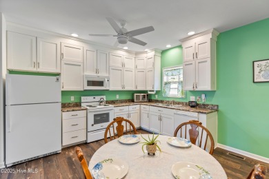 Welcome to this charming 2-bedroom, 2-bath home located just a on Oyster Bay Golf Links in North Carolina - for sale on GolfHomes.com, golf home, golf lot