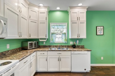 Welcome to this charming 2-bedroom, 2-bath home located just a on Oyster Bay Golf Links in North Carolina - for sale on GolfHomes.com, golf home, golf lot