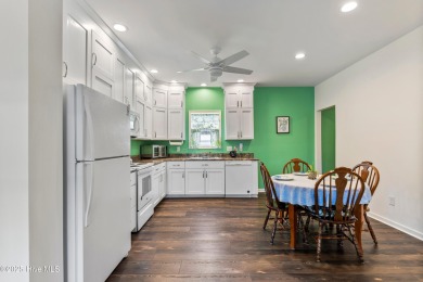 Welcome to this charming 2-bedroom, 2-bath home located just a on Oyster Bay Golf Links in North Carolina - for sale on GolfHomes.com, golf home, golf lot