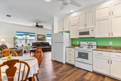 Welcome to this charming 2-bedroom, 2-bath home located just a on Oyster Bay Golf Links in North Carolina - for sale on GolfHomes.com, golf home, golf lot