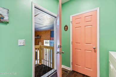 Welcome to this charming 2-bedroom, 2-bath home located just a on Oyster Bay Golf Links in North Carolina - for sale on GolfHomes.com, golf home, golf lot