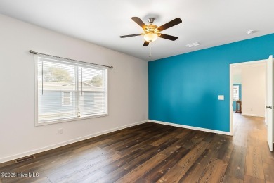Welcome to this charming 2-bedroom, 2-bath home located just a on Oyster Bay Golf Links in North Carolina - for sale on GolfHomes.com, golf home, golf lot