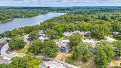 Discover this end-unit townhome with seasonal views of Lake on Bella Vista Country Club - Berksdale in Arkansas - for sale on GolfHomes.com, golf home, golf lot