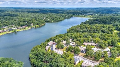 Discover this end-unit townhome with seasonal views of Lake on Bella Vista Country Club - Berksdale in Arkansas - for sale on GolfHomes.com, golf home, golf lot