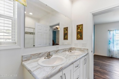 Welcome to this charming 2-bedroom, 2-bath home located just a on Oyster Bay Golf Links in North Carolina - for sale on GolfHomes.com, golf home, golf lot