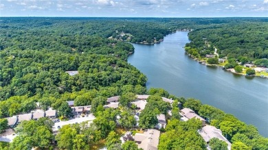 Discover this end-unit townhome with seasonal views of Lake on Bella Vista Country Club - Berksdale in Arkansas - for sale on GolfHomes.com, golf home, golf lot