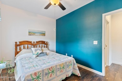 Welcome to this charming 2-bedroom, 2-bath home located just a on Oyster Bay Golf Links in North Carolina - for sale on GolfHomes.com, golf home, golf lot