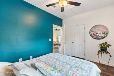 Welcome to this charming 2-bedroom, 2-bath home located just a on Oyster Bay Golf Links in North Carolina - for sale on GolfHomes.com, golf home, golf lot