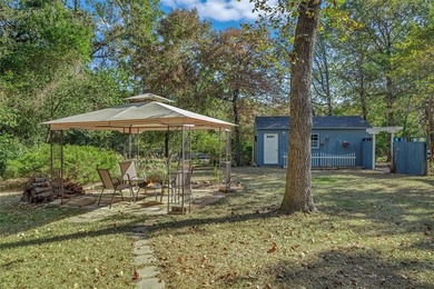 Fantastic curb appeal on this 3BD-2BA brick home in Holly Lake on Holly Lake Ranch Golf Club in Texas - for sale on GolfHomes.com, golf home, golf lot