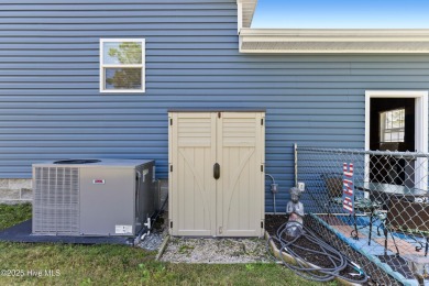 Welcome to this charming 2-bedroom, 2-bath home located just a on Oyster Bay Golf Links in North Carolina - for sale on GolfHomes.com, golf home, golf lot