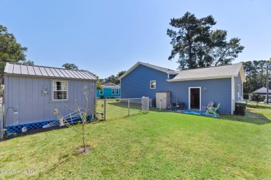 Welcome to this charming 2-bedroom, 2-bath home located just a on Oyster Bay Golf Links in North Carolina - for sale on GolfHomes.com, golf home, golf lot