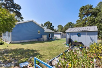 Welcome to this charming 2-bedroom, 2-bath home located just a on Oyster Bay Golf Links in North Carolina - for sale on GolfHomes.com, golf home, golf lot