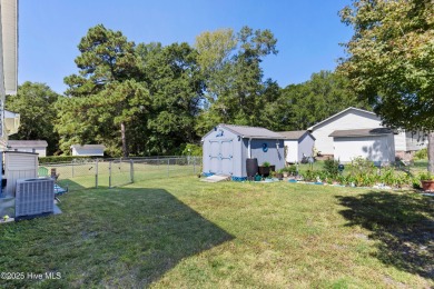 Welcome to this charming 2-bedroom, 2-bath home located just a on Oyster Bay Golf Links in North Carolina - for sale on GolfHomes.com, golf home, golf lot