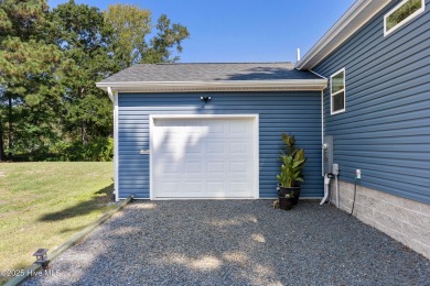 Welcome to this charming 2-bedroom, 2-bath home located just a on Oyster Bay Golf Links in North Carolina - for sale on GolfHomes.com, golf home, golf lot