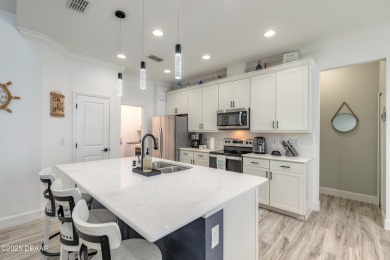 Discover the perfect blend of comfort and charm in this on LPGA International Golf Course in Florida - for sale on GolfHomes.com, golf home, golf lot