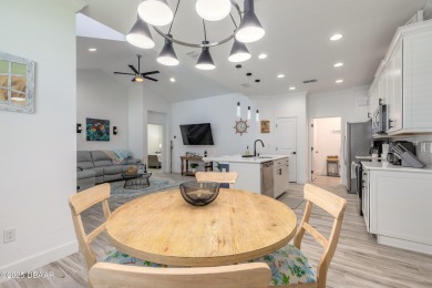 Discover the perfect blend of comfort and charm in this on LPGA International Golf Course in Florida - for sale on GolfHomes.com, golf home, golf lot