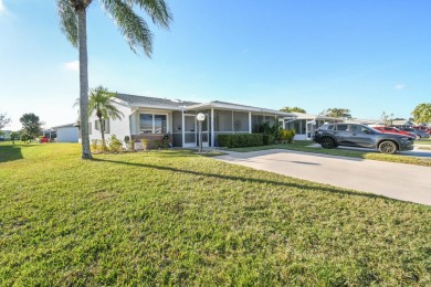Delightful one level townhouse with step saving kitchen and 2 on Cypress Lakes Golf Course - West Palm Beach in Florida - for sale on GolfHomes.com, golf home, golf lot