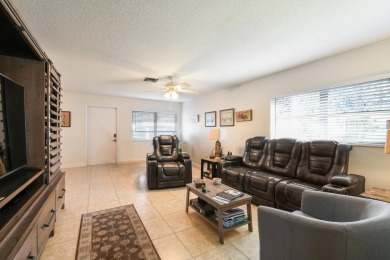Delightful one level townhouse with step saving kitchen and 2 on Cypress Lakes Golf Course - West Palm Beach in Florida - for sale on GolfHomes.com, golf home, golf lot