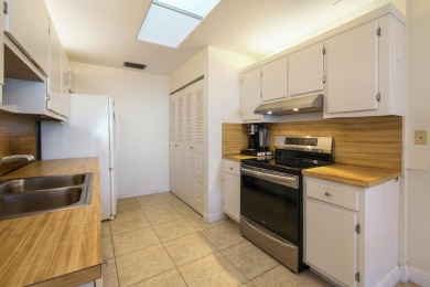 Delightful one level townhouse with step saving kitchen and 2 on Cypress Lakes Golf Course - West Palm Beach in Florida - for sale on GolfHomes.com, golf home, golf lot