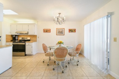 Delightful one level townhouse with step saving kitchen and 2 on Cypress Lakes Golf Course - West Palm Beach in Florida - for sale on GolfHomes.com, golf home, golf lot