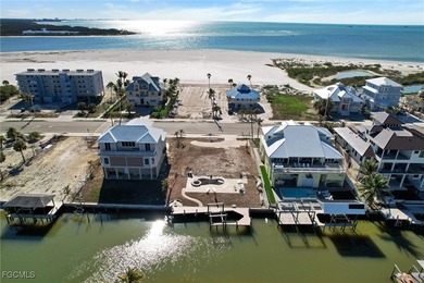 Located in the quaint boating community of Laguna Shores on Fort Myers Beach and Golf Club in Florida - for sale on GolfHomes.com, golf home, golf lot