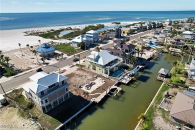 Located in the quaint boating community of Laguna Shores on Fort Myers Beach and Golf Club in Florida - for sale on GolfHomes.com, golf home, golf lot