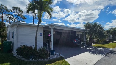 Nestled within the highly sought-after golf course community of on Blue Heron Pines Golf Course in Florida - for sale on GolfHomes.com, golf home, golf lot