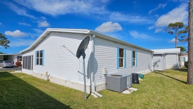 Nestled within the highly sought-after golf course community of on Blue Heron Pines Golf Course in Florida - for sale on GolfHomes.com, golf home, golf lot