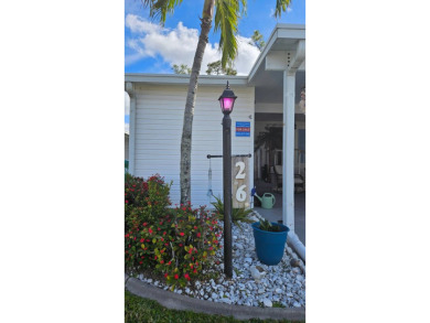 Nestled within the highly sought-after golf course community of on Blue Heron Pines Golf Course in Florida - for sale on GolfHomes.com, golf home, golf lot