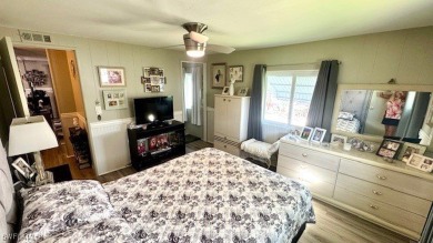 Welcome to this charming and well-maintained manufactured home on Riverbend Golf and Country Club in Florida - for sale on GolfHomes.com, golf home, golf lot