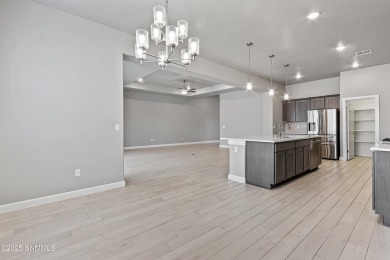 This beautifully landscaped 4-bedroom, 3-bath home spans 2,435 on Sonoma Ranch Golf Course in New Mexico - for sale on GolfHomes.com, golf home, golf lot