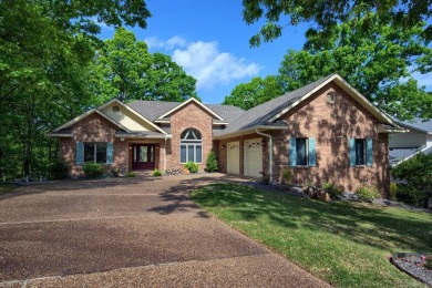 A SERENE RETREAT!  Meticulously landscaped, this tastefully on Cortez Golf Course in Arkansas - for sale on GolfHomes.com, golf home, golf lot