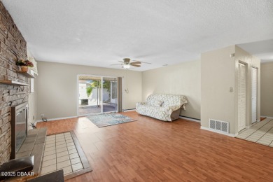 Savor the Florida lifestyle in this charming three-bedroom pool on Daytona Beach Golf Club in Florida - for sale on GolfHomes.com, golf home, golf lot