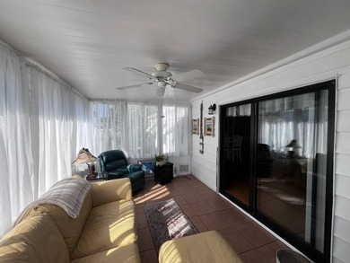 Beautifully maintained 2-bedroom, 2-bath home offering comfort on Lake Henry Golf Club in Florida - for sale on GolfHomes.com, golf home, golf lot