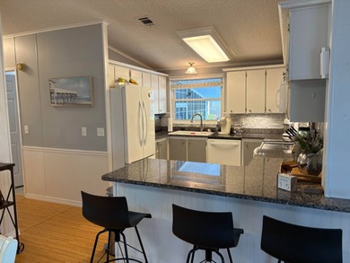 Beautifully maintained 2-bedroom, 2-bath home offering comfort on Lake Henry Golf Club in Florida - for sale on GolfHomes.com, golf home, golf lot