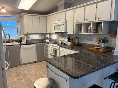 Beautifully maintained 2-bedroom, 2-bath home offering comfort on Lake Henry Golf Club in Florida - for sale on GolfHomes.com, golf home, golf lot