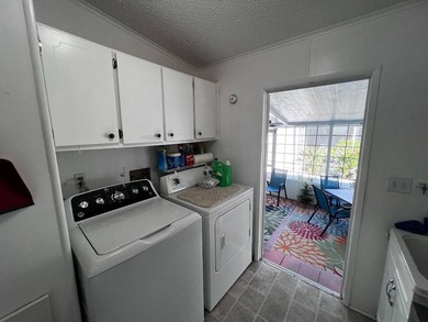 Beautifully maintained 2-bedroom, 2-bath home offering comfort on Lake Henry Golf Club in Florida - for sale on GolfHomes.com, golf home, golf lot